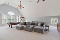 Massive bonus room with built in's, wet bar, fireplace, and storage - second level.