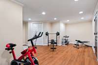 Basement apartment flex room, currently used as a fitness room.