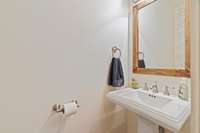 Hall bath - main level right next to kitchen and dining room. Also just off of the garage and laundry room.