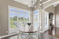 Breakfast nook with lots of natural light. Door leads to the backyard deck and pool area.