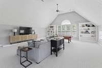 Massive bonus room with built in's, wet bar, fireplace, and storage - second level.