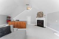 Massive bonus room with built in's, wet bar, fireplace, and storage - second level.