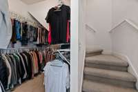3-story master closet. Stairs lead the the next two levels.