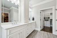 The en-suite bathroom features double vanities with Carerra marble countertops and ample cabinetry for convenient storage of all your essentials.  4416 Attleboro Dr. Murfreesboro, TN 37128