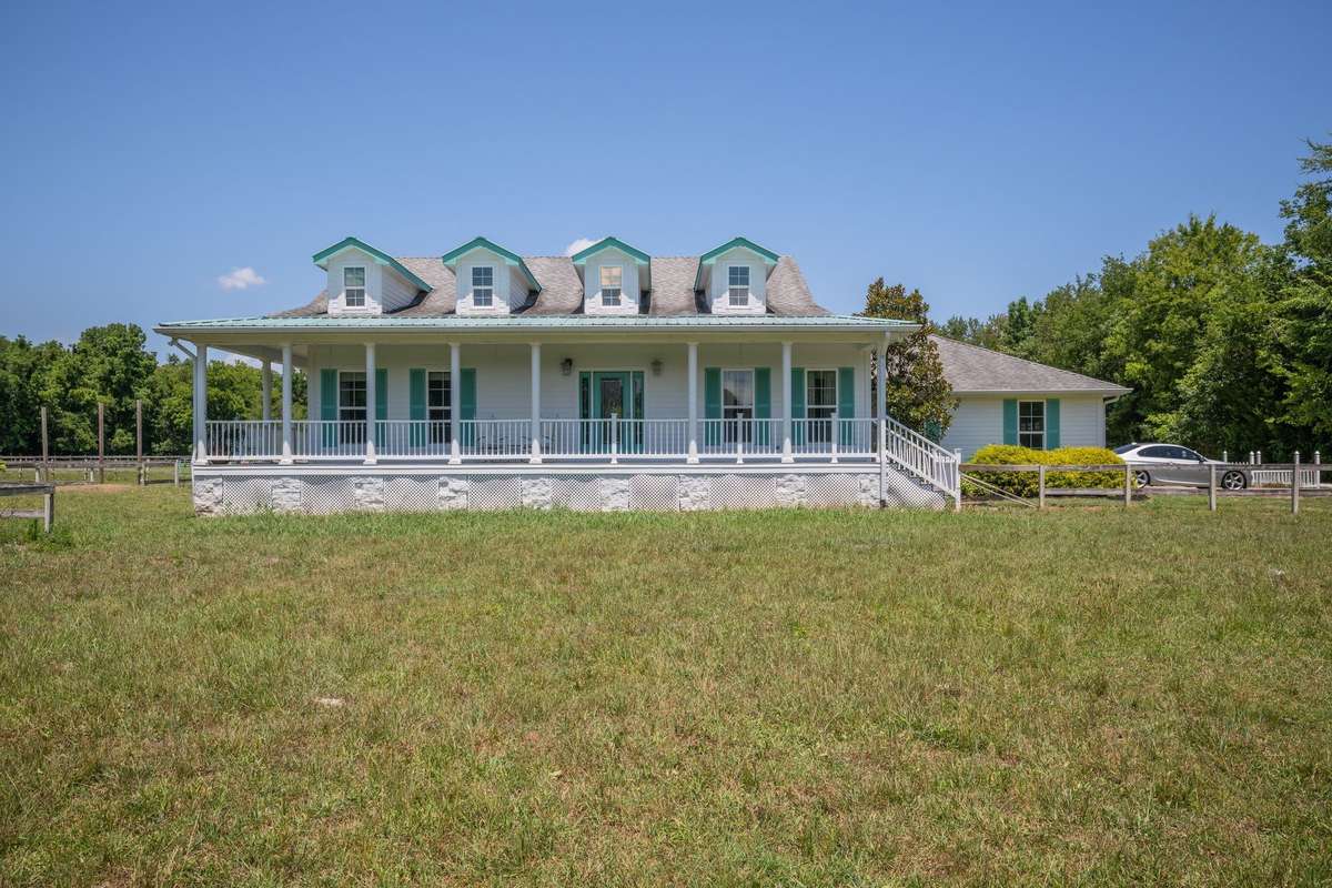 Front view of 2290 Osburn Rd, Arrington, with oversized garage and 4 gabled roof.