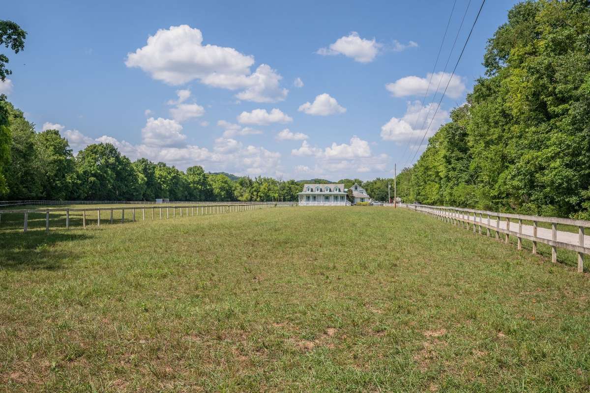 Nice level, fenced, and cross fenced farm with single level home and barndominium.