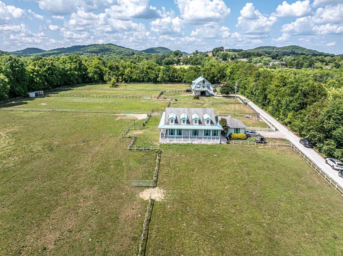 Nicely designed home with wrap around, covered porch and double garage, plus additional parking for visitors.