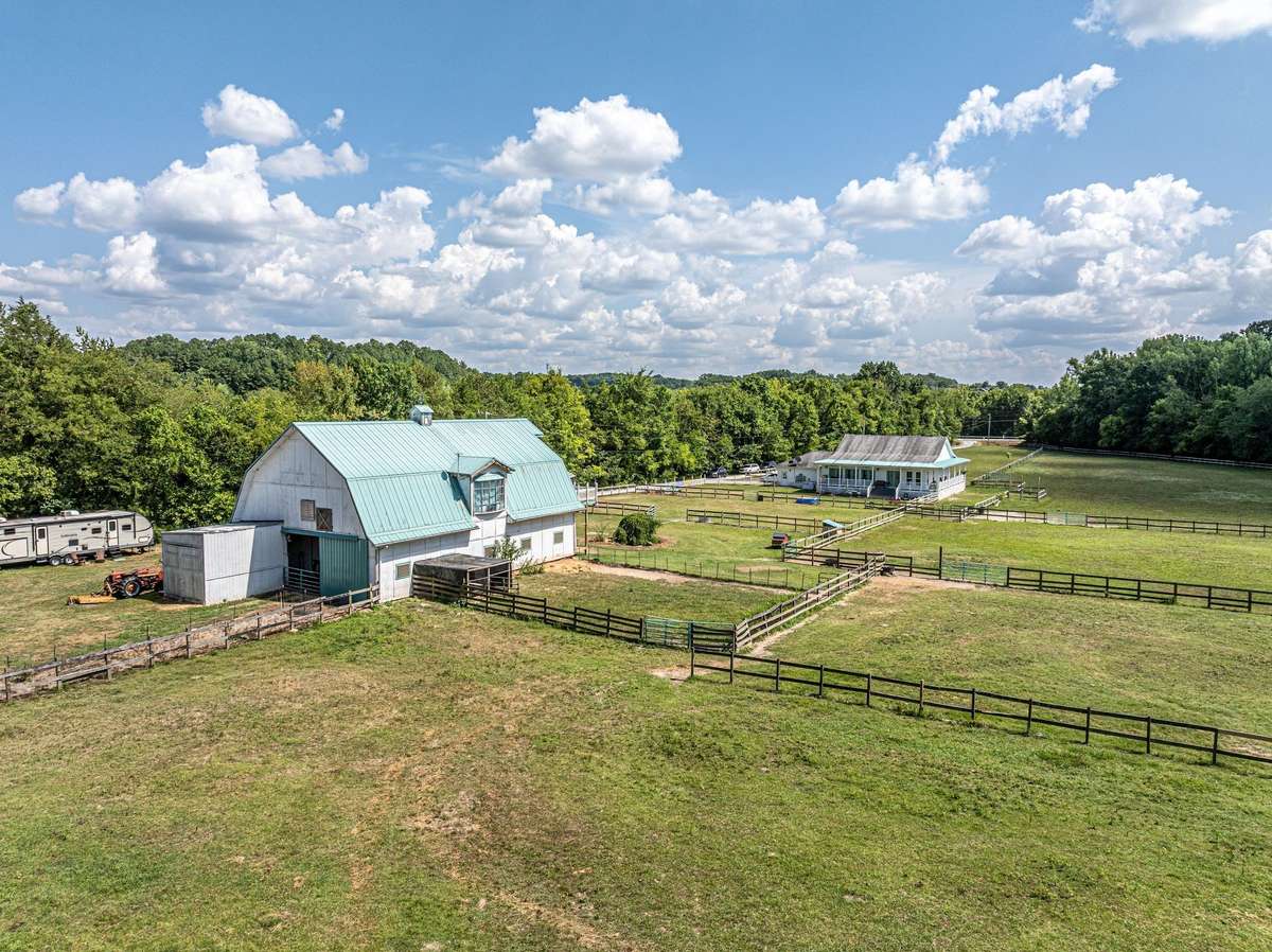 Terric view of cross fencing, barn, and even home in the background.