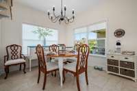 Large breakfast area with Artisan tile flooring.  Natural sunlight and plenty of space for a buffet or hutch