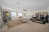 This bonus room upstairs is HUGE!!!  Can be a bedroom, inlaw space with living and sleeping area, etc  There are TWO walk in closets AND a full bath!