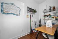 Back hallway storage room large enough for crafting, sewing, or just storing the extras