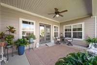 Back covered patio is the perfect way to start and end your day.  Peaceful and spacious for a table and chairs, couch, and anything else to help you relax.