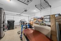 Garage...I don't normally show photos of the garage but this one has epoxy flooring as well as garage racks that are lowered to load then raised back up for storage above the parked cars.