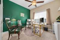 Secondary bedroom currently used as an office.  Large closets, ceiling fan, and a large window for sunlight