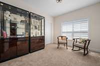 3rd bedroom used as a sitting room.  Large closet for storage or clothing if used as a bedroom. Custom blinds in each room.