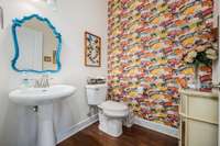 Powder room located down the hallway for privacy.  Wallpaper professionally installed...loving the butterflies to add a more vivid color scheme!