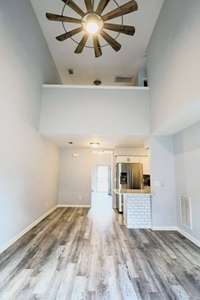 The solid surface laminate plank flooring throughout makes cleaning easy!