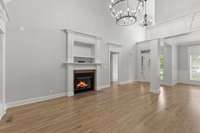 Great Room features vaulted ceiling, fireplace and heavy custom mouldings.