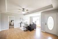 The large living area offers plenty of space to relax, entertain, or gather with family and friends.