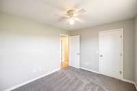 The guest room includes a spacious closet for convenient storage.