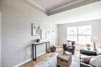 Enjoy laminate flooring and fresh paint that give the living room a clean, move-in-ready feel.
