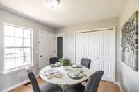 Large windows provide great natural light, making the dining space feel open and inviting.
