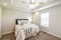 The primary suite is located on its own side of the home for added privacy and relaxation.