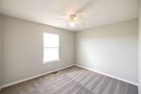 The window fills the room with light, making the space bright and inviting.