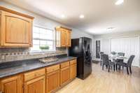 The kitchen seamlessly connects to the dining area and deck, making entertaining easy.