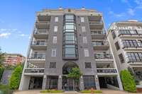 Welcome to 117 30th Ave N, Unit 401 - a boutique luxury mid-rise condominium that blends modern architecture with classic urban charm.