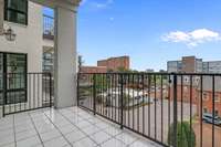 Step outside onto your private balcony to enjoy morning coffee or sunset views overlooking the vibrant cityscape.