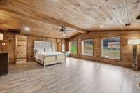 Owner Suite upstairs in Garage/Bunk house with full bath. Hidden Entrance