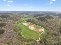 Aerial photo showing large open area on the property.