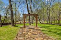 Outside wedding arch area at the Event Venue along side a beautiful creek