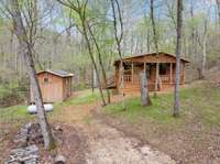 Off 2 bedroom/2 bath off grid cabin - about 2 miles from the main lodge. Private and overlooks a waterfall!