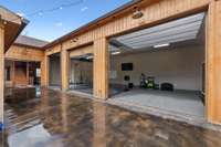 Archery similator area full set up in Main lodge that opens up with garage doors to the outdoor kitchen lounge area just across from the game/armory area.