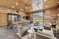 Main lodge kitchen with view of open air garage doors