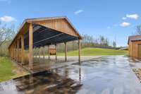 Outside pavilion with beautiful finished garage floor and chandeliers. Can also be used for parking that is located behind the Main Lodge