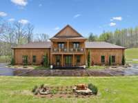 Main lodge housing 4 bedroom/4 baths plus bunk room, large gathering areas where guests check in, main bar lounge, kitchen dining room, indoor archery similator, game room, etc.