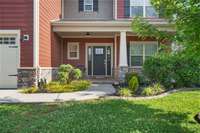 Covered porch for sipping your morning coffee and greeting neighbors!