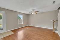 The living room has so much natural light with views to a great backyard and no neighbors directly behind you.