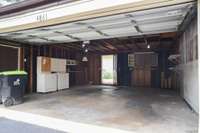 Double garage with 2 pedestrian doors, and extra storage overhead.