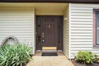 The front entry has beautiful side lights, adding both light and style.