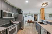 *NEW CABINETRY, TILE BACKSPLASH AND STAINLESS STEEL APPLIANCES THAT WILL REMAIN WITH THE PROPERTY*