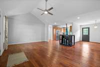 Large living room open to dining room and kitchen.