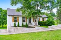 Lovely landscaping, shutters and gutters