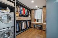 His/hers custom closets include a stackable washer dryer hook up and a marble vanity.