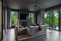 This sunroom has a gorgeous wood burning fireplace with a gas starter.