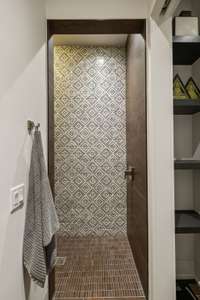 This full bathroom off the gym as a zero entry shower.