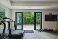 Keep these gorgeous sliding doors in the gym open or closed during your workouts and walk out to a great patio.